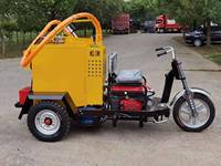 Machine de scellement routier bitumineuse automotrice pour la réparation des nids-de-poule