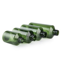 Flacons d'échantillons de 50 ml, 100 ml, 200 ml, 500 ml vert foncé à épaule inclinée pour hydrolats et toniques avec bouchon pompe en plastique pour liquides et médicaments