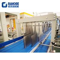 Machine d'emballage thermorétractable automatique à film couleur monobloc pour bouteille en plastique