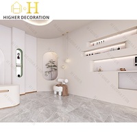 Meuble de présentation de parfums de niche style crème, vitrine incurvée murale pour boutique de parfums