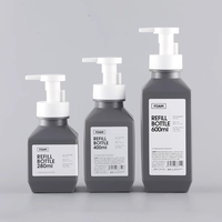 Flacon pompe en plastique PET design tendance à épaule oblique pour savon moussant et crème visage 280ml 400ml 600ml