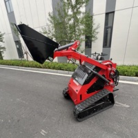 Mini-chargeuse compacte sur chenilles OEM à économie d'effort avec tarière et godet en V pour travaux d'excavation sur autoroutes et fermes