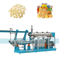 Extrudeuse à double vis pour la production de snacks soufflés en forme d'anneau