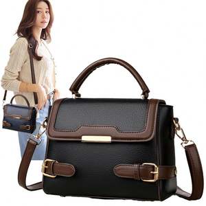 Bolso de mano para mujer de piel de vaca y tela vaquera de diseño moderno de primera calidad informal para llevar debajo del - Product Image 1