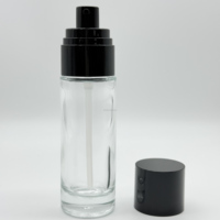 Paquet de maquillage vide bouteille de lotion de soin de la peau bouteille de pompe noire en verre rond de cylindre de 50ml pour les soins de la peau