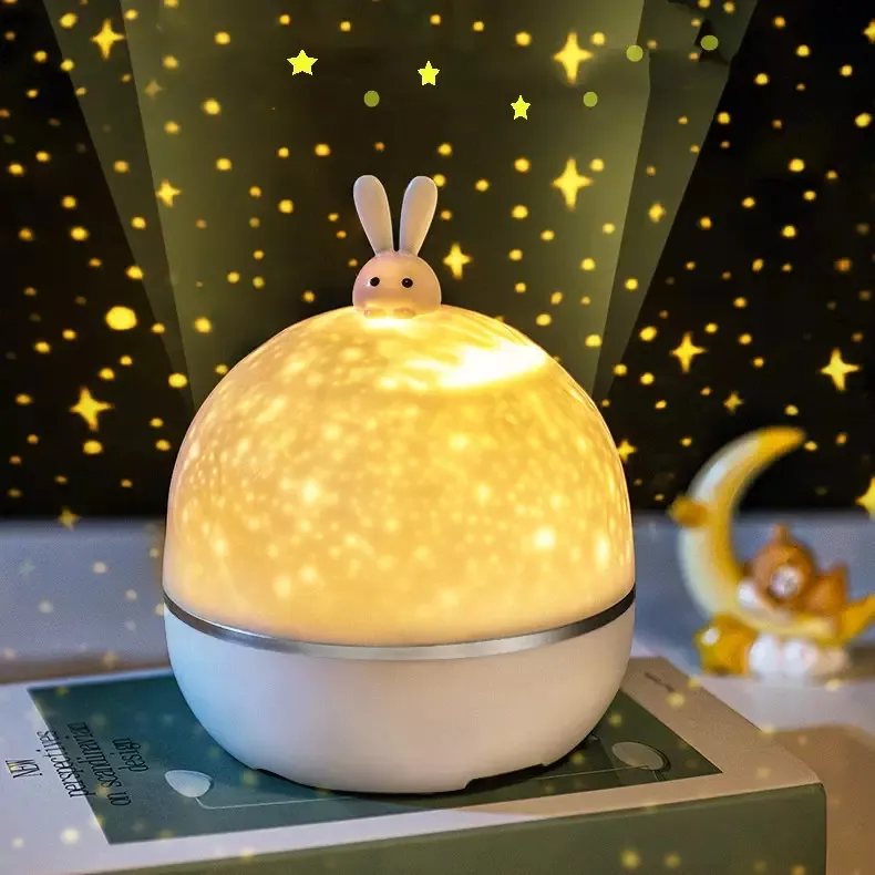 Regalo di natale nuovo popolare proiettore stella lampada da notte rotante coniglio proiezione luce notturna USB ricaricabile musica Moonlight