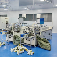 Machine d'emballage flexible pour serviettes en papier et serviettes en coton jetables avec fonction de raccordement de ligne de traitement et d'assemblage tout-en-un