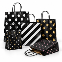 Sac en papier noir brillant ECO avec pois blancs et poignée en corde pour emballage cadeau en gros