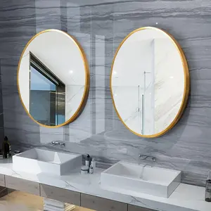 Grand miroir mural en alliage d'aluminium personnalisé avec cadre rond et doré pour la décoration de la salle de bain.