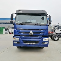 Camion benne SINOTRUCK HOWO 6X4 à bras articulé pour le ramassage automatique des déchets et des conteneurs à ordures, à vendre