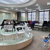 Vente en gros entrepôt de stockage en acier empilable hôtel événement mariage banquet chaise pliante chariot/chariot