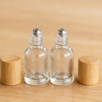 Flacon roll-on en verre écologique personnalisé de 10 ml avec bouchon en bambou pour l'emballage d'huiles essentielles, de parfums et de déodorants
