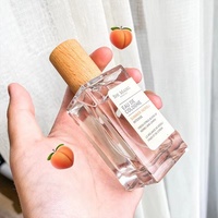 Flacon de parfum en verre transparent de forme rectangulaire de 30 ml, 50 ml, 100 ml avec pompe pulvérisatrice blanche en plastique pour les soins de la peau