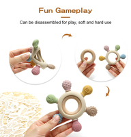 Vente en gros de jouets sensoriels souples multi-textures en silicone de qualité alimentaire et bois, en forme de hochet pour bébé, sans BPA, pour soulager les gencives des nouveau-nés de 0 à 12 mois, OEM