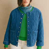 Nouvelle conception, veste matelassée pour femme, aspect denim, col rond, fermeture à boutons-pression, poches plaquées, vêtements d'extérieur décontractés, vente en gros
