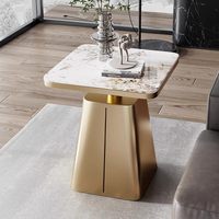 Table basse compacte de luxe léger avec plateau en pierre et structure en fer, design moderne et créatif pour salon