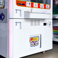 Machine de jeu d'arcade commerciale avec grue et armoire métallique pour divertissement en intérieur, avec garantie d'un an et manuel d'utilisation en anglais