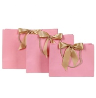 Bolsa de papel rosa de lujo, bolsas de regalo de papel para ropa, embalaje de bolsa de papel personalizado de buena calidad