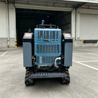 Chargeuse compacte robuste avec changement d'attaches facile pour les travaux de maintenance routière