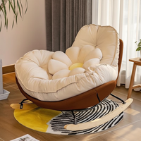Fauteuil à bascule Snail, coussin capitonné crème, cuir synthétique, structure en métal noir, bascule en bois, ergonomique, vente en gros, Sessel