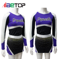 Tenue de performance Elite Cheer |   Uniforme de cheerleading violet, noir et argenté, à épaules dénudées, avec accents en strass et découpe au dos, service OEM