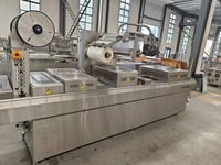 Machine d'emballage par thermoformage automatique sous vide pour la transformation de viandes de charcuterie