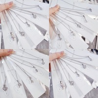Vente directe fabricant : Collier hybride polyvalent en acier inoxydable, anti-allergie, inaltérable, personnalisable, avec chaînes aléatoires, style mode