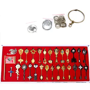 De gros anime fairy tail accessoires-Porte-clés queue de fée en or, 29 pièces/ensemble, clés, colliers, accessoires de Cosplay, ensemble d'armes, vente en gros