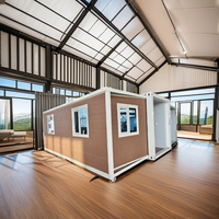 Maison conteneur pliable de luxe Maison capsule de luxe préfabriquée avec terrasse extensible et maison mitoyenne