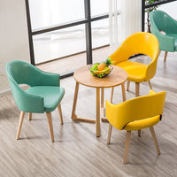 Fauteuil de salon individuel en bois massif de style nordique minimaliste avec dossier rembourré, démontable pour l'étude, la salle à manger ou l'utilisation informatique