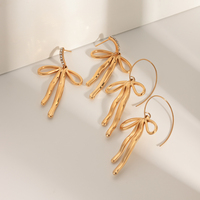 Boucles d'oreilles J&D New Trend Luxury pour femmes, plaquées or 18 carats, en acier inoxydable, avec zircon, en forme de nœud, pour filles