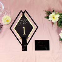 Supports de numéros de table élégants en acrylique noir en forme de diamant avec base noire et accent doré pour mariage