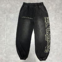 Pantalon de survêtement pour homme, coupe ample, délavé soleil, avec revers élastiques et logo imprimé effet vieilli