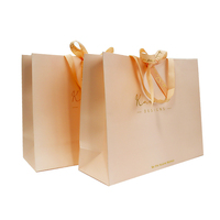 Sac en papier de luxe noir pour boutique de soie, nouveau design, avec logo personnalisé, pour emballage cadeau