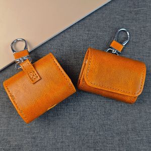 เคสหนังลายวัวแบบเรโทรสำหรับ AirPods พร้อมห่วงคล้องหนัง PU และคาราไบเนอร์ป้องกันการสูญหาย - Product Image 1