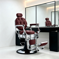 Fauteuil de barbier vintage haut de gamme, capitonnage bordeaux à motifs losanges, structure chromée robuste et repose-pieds antidérapant.