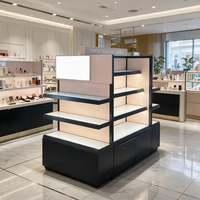 Présentoir de Cosmétiques Multi-Faces pour Magasin, Îlot d'Exposition Blanc avec Étagères Rétroéclairées, Vitrine Lumineuse à Cadre Foncé, Meuble de Rangement Autoportant Type Gondole