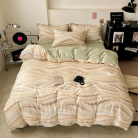 Parure de lit 4 pièces en coton imprimé, douce et agréable pour la peau, comprenant une housse de couette, un drap plat et des taies d'oreiller pour la chambre à coucher.
