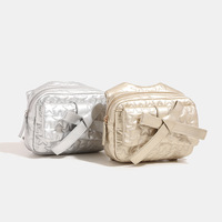 Sac à dos en PU avec nœud pour femme, nouvelle collection été 2024, petit sac de voyage haut de gamme à bandoulière unique avec chaîne, fermeture éclair