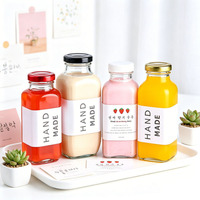 Bouteille en verre transparente de forme carrée avec bouchon à vis coloré pour jus, lait de fraise, boisson, conception d'étiquette personnalisée, emballage