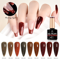 Vernis à ongles gel disco réfléchissant à paillettes rouges et brunes de Noël Deroi, gel UV sans HEMA, sans TPO