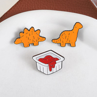 Nouveau dessin animé créatif mignon roman en forme de dinosaure pépites de poulet biscuits Sauce tomate émail doux épinglette