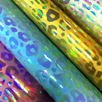 Cuir PU léopard laser gaufré effet miroir, épaisseur 0,7 mm, résistant à l'abrasion, avec fond en laine, couleur magique, vente en gros usine