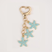 Nouveau porte-clés créatif en alliage de zinc, pendentif étoile de mer coloré, fermoir en forme de cœur, petit cadeau pour femme
