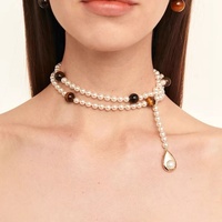 Collier long en cuivre imitation perle, style luxe léger, avec pierre œil de tigre, tendance automne-hiver