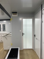 Maison conteneur pliable et extensible à double aile, assemblage rapide, grand espace, clé en main, prête pour l'hôtellerie, les séjours à la maison d'hôtes et la location.