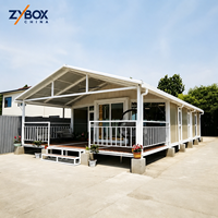 ZYBOX Maison Conteneur Pliable Extensible 20FT à Châssis Acier, Montage Rapide, Utilisation Polyvalente, avec Cuisine, Salle de Bain et 2 Chambres