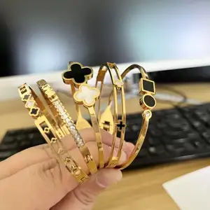 Großhandel edelstahl offenes Armband Schmuck Glücksgeschwindigkeits-Gold-Vierblättriger Kleeblatt-Armband Manschetten-Armband für Damen und Mädchen