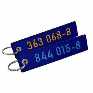 Porte-clés personnalisé double face vierge en tissu tissé, avec bord brodé, logo aviation, et bande de tissu enveloppée - Product Image 2