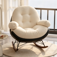 Fauteuil à bascule Egg Shell au design moderne, chaise longue en PU noir, tissu capitonné crème, support métallique double triangle